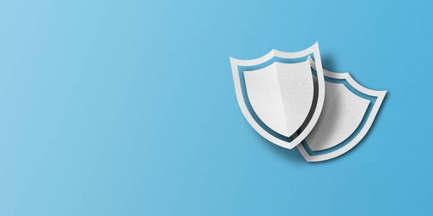 white paper shield Punched paper cut out shield shape set on light blue paper background. - Foto, afbeelding