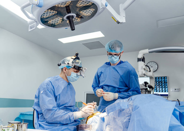Modern surgery team in hospital room. Emergency specialists working in ward. - Fotó, kép