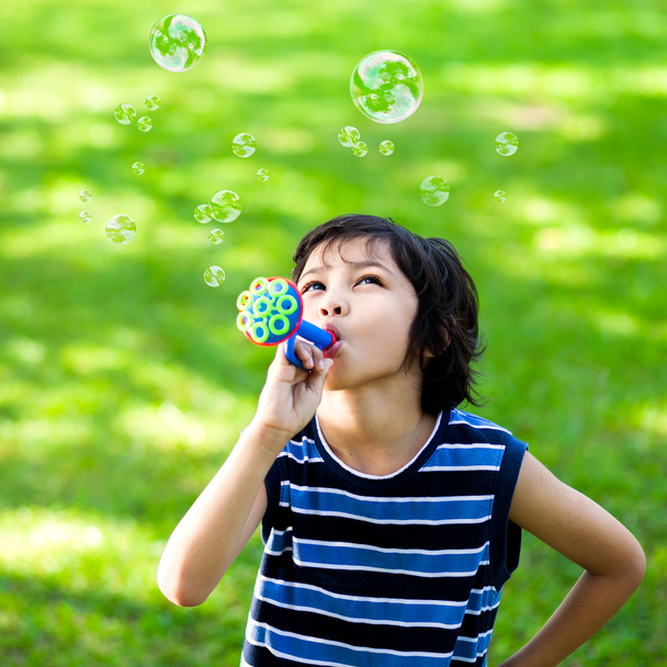 Little boy making soap bubbles - Photo, Image