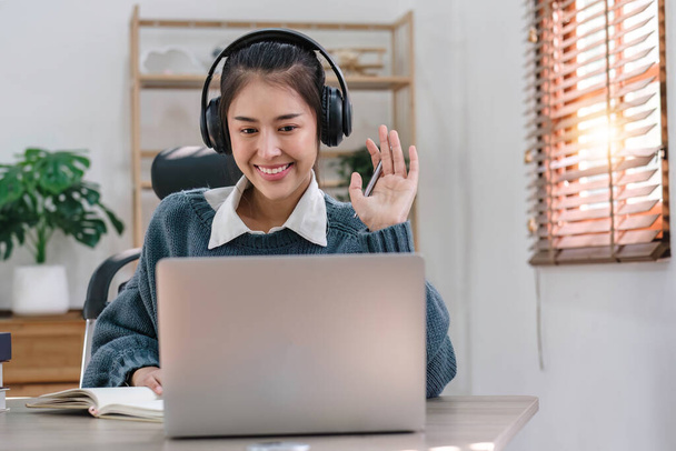 Asian girl student online learning class study online video call zoom teacher, Happy asian girl learn english language online with computer laptop.... - 写真・画像