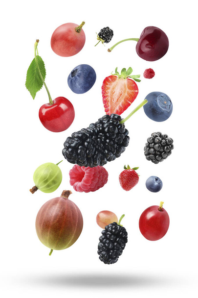 Many different fresh berries falling on white background - Photo, image