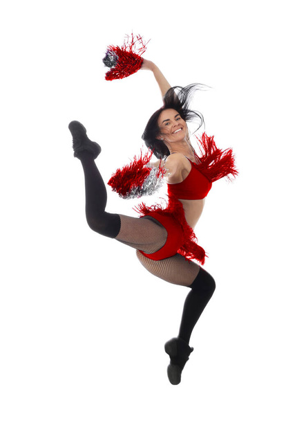 Beautiful cheerleader in costume jumping on white background - Photo, image