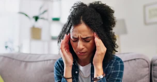 Sick woman, headache and pain of stress, dizzy mind or mental health crisis in lounge. Sad young female, migraine and anxiety of burnout, frustrated problems or depression of fatigue, debt or vertigo. - Footage, Video