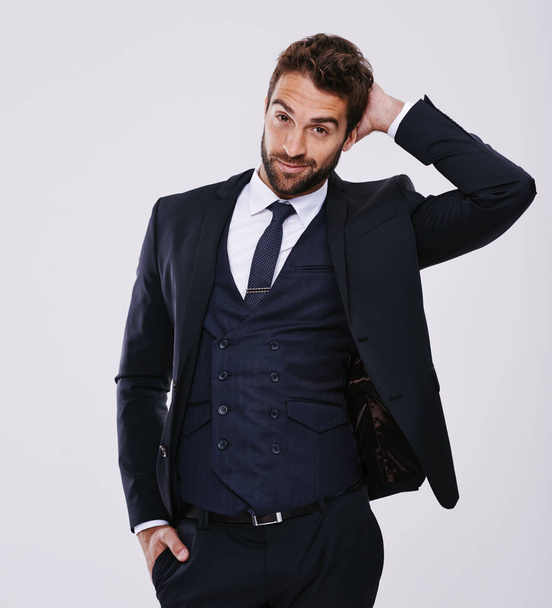 Handsome and successful. Studio shot of a well-dressed man against a gray background - Foto, immagini