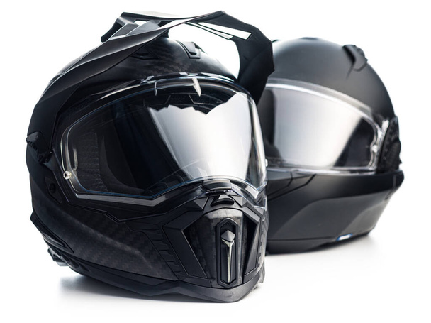 Black carbon motorcycle helmet. Offroad motocross helmet with shield isolated on the white background. - Valokuva, kuva