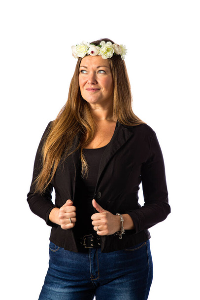 Isolated forty year old woman wearing a sport jacket and a crown of flower - Фото, зображення