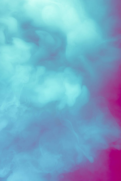 Creative multicolored design for wallpapers, background and advertisement. Pink and blue smoke spreading in neon. Smoke texture. Modern abstract design. Colorful combination - Foto, afbeelding