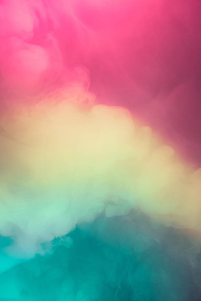Abstract colorful, multicolored smoke spreading, bright background for advertising or design, wallpaper for gadget. Neon lighted smoke texture, blowing clouds. Smoke texture. Modern design - Valokuva, kuva