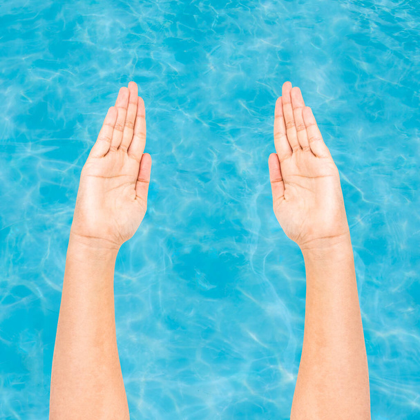 Hands preparing to swim with water background - Photo, Image
