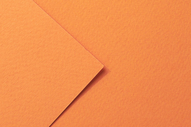 Rough kraft paper pieces background, geometric monochrome paper texture orange color. Mockup with copy space for text - Fotó, kép