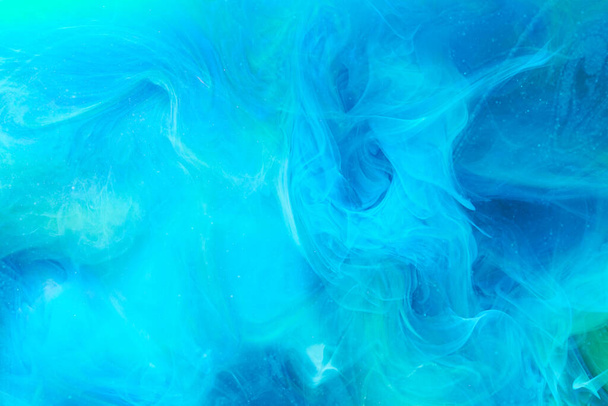 Blue contrast liquid art background. Paint ink explosion, abstract clouds of smoke mock-up, watercolor underwater - Photo, Image