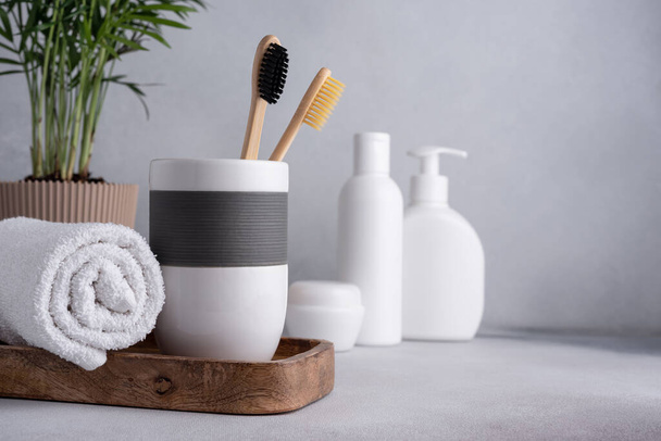 Bathroom composition with bamboo toothbrushes. Eco friendly bodycare concept. - Фото, изображение