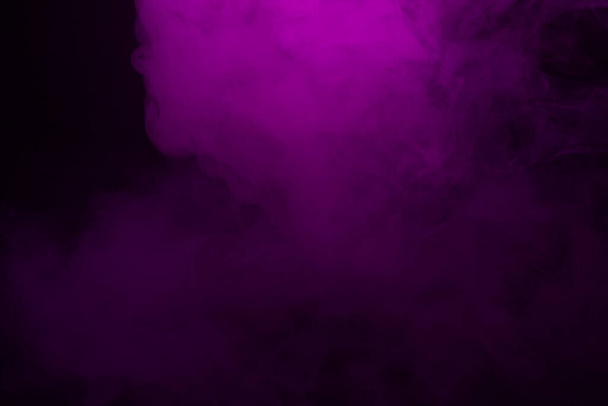 Colorful smoke close-up on a black background - Фото, зображення