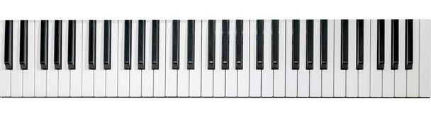 ピアノキーボード、フラットトップビュー。水平画像。フラットレイ画像として上から撮影された黒と白のピアノキー - 写真・画像