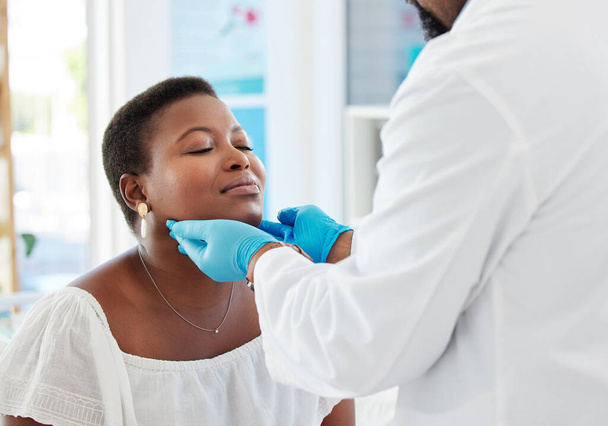 Doctor, patient with sore throat and medical exam, consultation in hospital and healthcare with health insurance. Check facial lymph nodes, black woman with man and medicine professional in clinic. - Foto, Bild