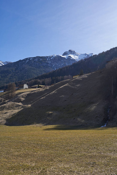 Neustift im Stubaital, Austria - March 16, 2023 - beautiful meadows and hillsides near Neustift at the end of the winter season                                   - Foto, Imagen
