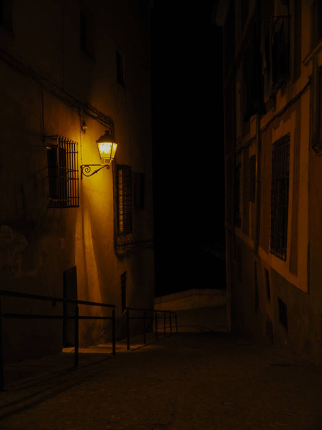 STREETS OF CUENCA CAPITAL AT NIGHT ILLUMINATED BY ITS WARM STREETLIGHTS - Zdjęcie, obraz
