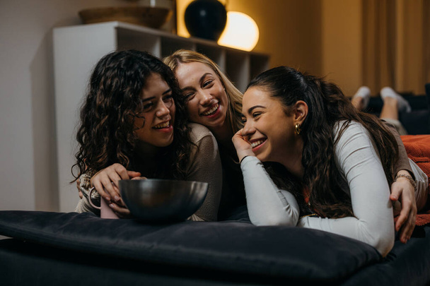 Happy three female friends are laughing and having fun time together - Foto, imagen