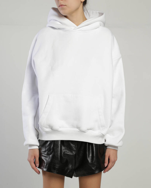 women's hoodie on the model on a white background isolated - Foto, Bild