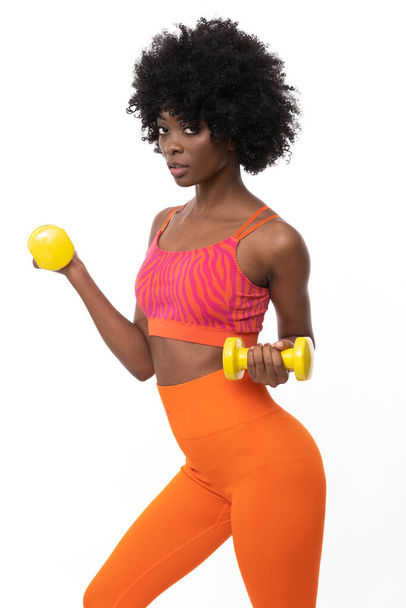 Fitness  trainer with curly hair on isolated white background. - Foto, afbeelding