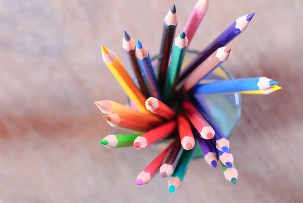 Colorful pencils on color wooden background - Photo, Image