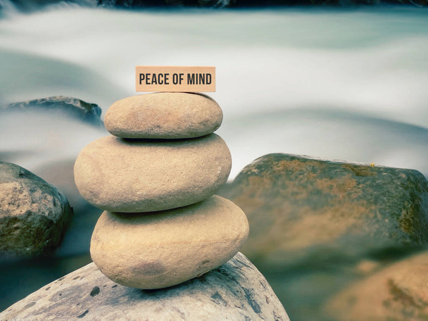 Peace of mind text on wooden block with nature background. - Photo, Image