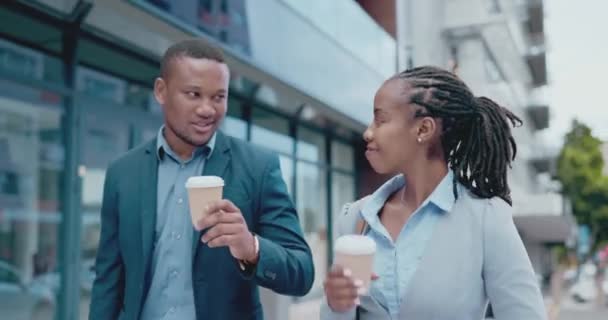 Coffee, cheers and a black business team walking in the city during their morning commute into work together. Collaboration, talking and takeaway with professional colleagues outdoor in an urban town. - Footage, Video