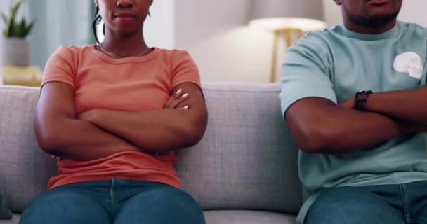 Couple, divorce and arms crossed in argument on sofa, home and breakup problems. Closeup of angry man, woman and ignoring partner in fighting, toxic relationship and drama of conflict, crisis or fail. - Footage, Video