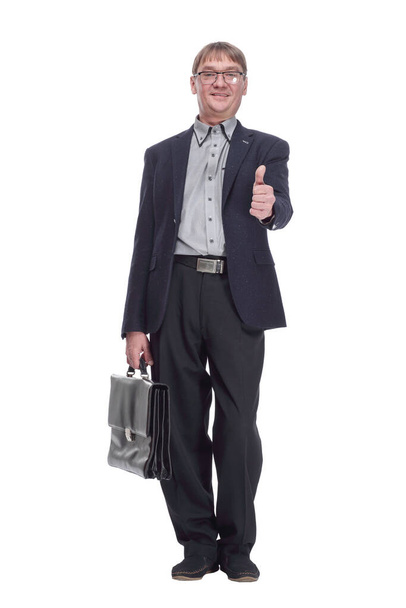 in full growth. senior business man with a leather briefcase looking at you. isolated on a white background. - Фото, изображение