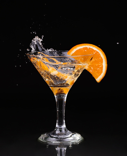 Vermouth cocktail inside martini glass over dark background - Photo, image