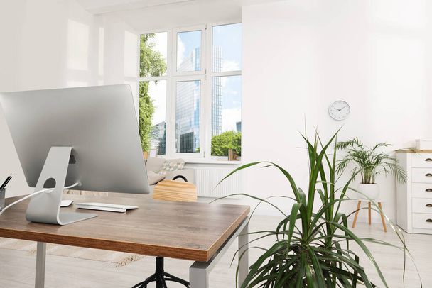 Comfortable workplace in stylish room. Home office - Фото, зображення