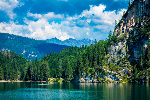 Dolomites. Braies lake and boats. Emerald colors on the water. - Photo, Image
