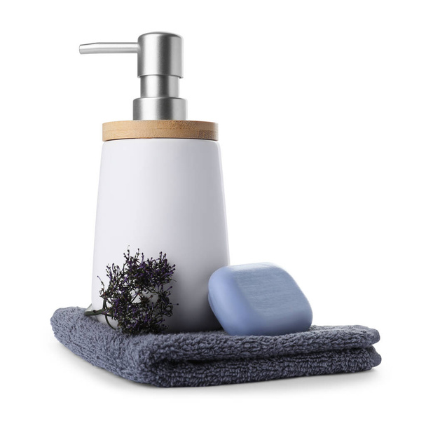 Soap bar, dispenser and terry towel on white background - Foto, imagen