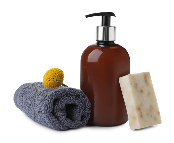 Soap bar, dispenser and terry towel on white background - Zdjęcie, obraz
