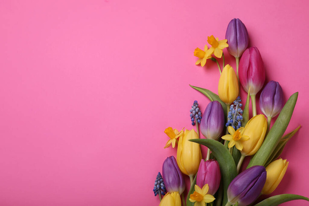 Beautiful different flowers on pink background, flat lay. Space for text - Foto, immagini