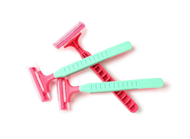 Colorful safety razors on white background - Foto, afbeelding