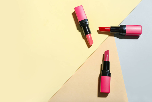 Composition with beautiful lipsticks on color background - Фото, изображение