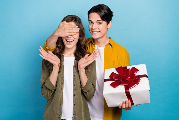 Photo advert of two excited people lovely couple international woman day boyfriend close eyes girlfriend delivery giftbox isolated on blue background. - Fotoğraf, Görsel