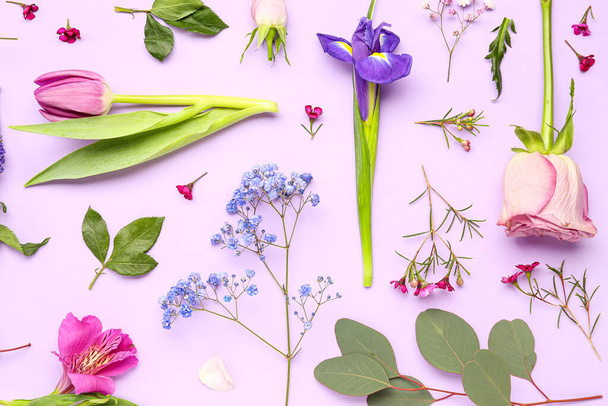 Beautiful flowers on lilac background - Фото, изображение