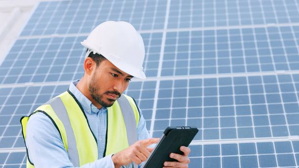Solar, electricity and construction being done by an engineer while using a tablet for research or planning. Portrait of one young engineer browsing on technology. - Фото, изображение