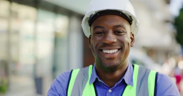 Architect face, construction worker and black man happy for real estate development, property project or career pride. Architecture engineering, portrait and person with PPE, confidence and smile. - Footage, Video