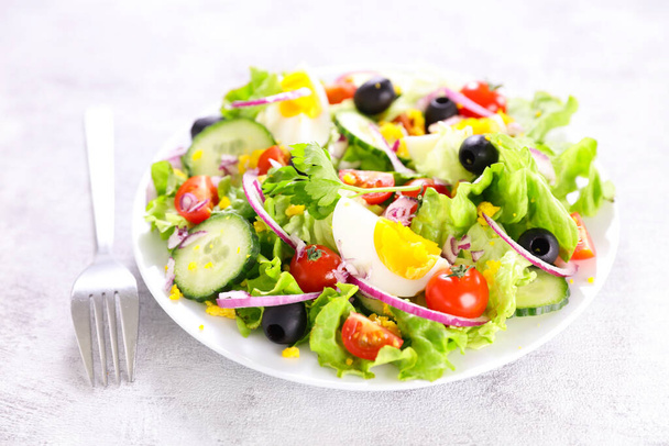 healthy vegetable salad with fresh lettuce,  tomato, cucumber and egg- diet food, healthy eating concept - Zdjęcie, obraz