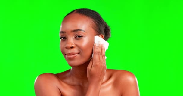 Black woman, wipe to remove makeup on green screen and beauty with face, smile and cosmetic care. Facial, skincare and hygiene with dermatology and female in portrait on studio background with mockup. - Filmagem, Vídeo