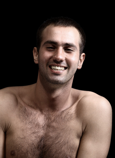 Young man face expressions over black background - 写真・画像