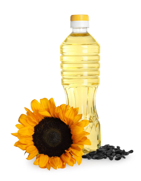 Sunflower cooking oil, seeds and yellow flower on white background - Foto, immagini