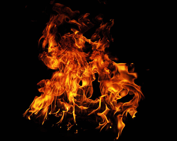 Fire blaze flames on black background. Fire burn flame isolated, abstract texture. Flaming explosion with burning effect. Fire wallpaper, abstract art pattern - 写真・画像