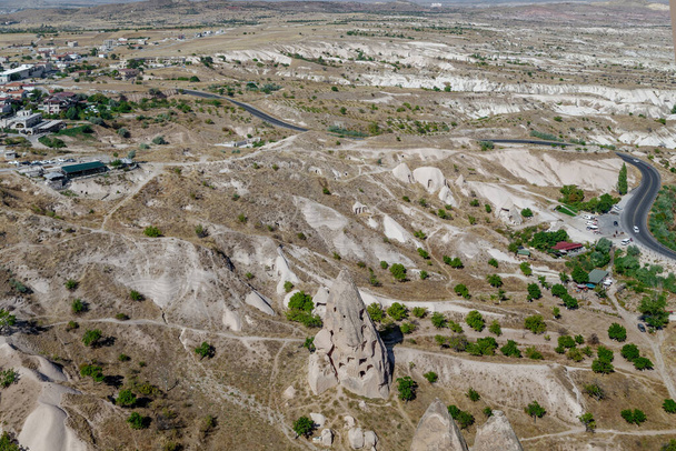 This is an aerial view of one of the valleys of Cappadocia with a fabulous landscape and rocks of volcanic origin. - Фото, зображення