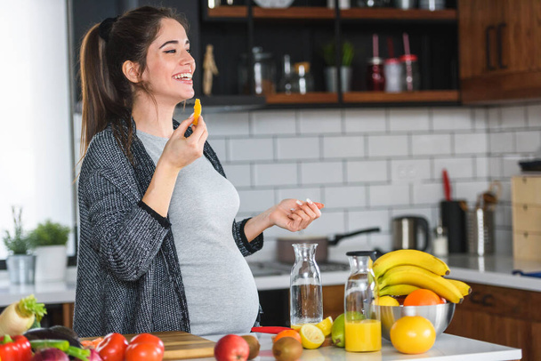 woman cutting fruits in kitchen, healthy food concept  - Zdjęcie, obraz
