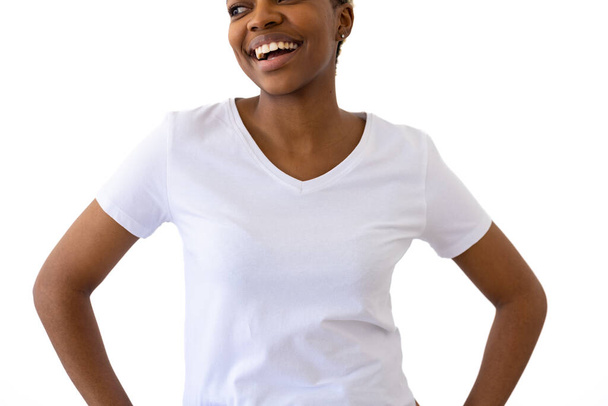 African american woman wearing white t-shirt with copy space on white background. Clothes, fashion, style and design. - Фото, зображення