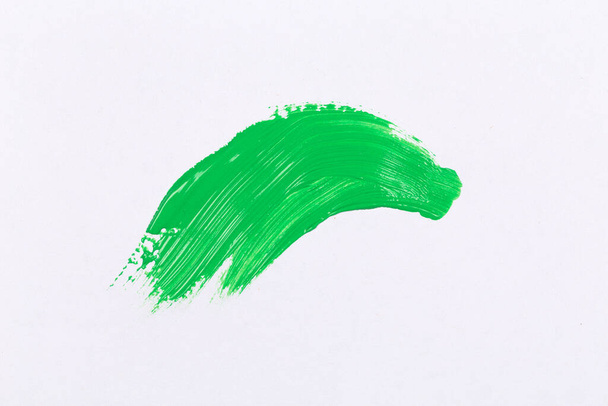 green texture splash stroke of the paint brush on white paper background - Foto, afbeelding